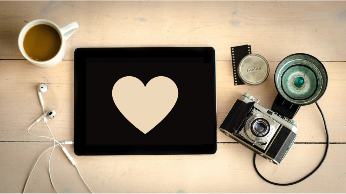 A heart-shaped paper on top of a wooden table