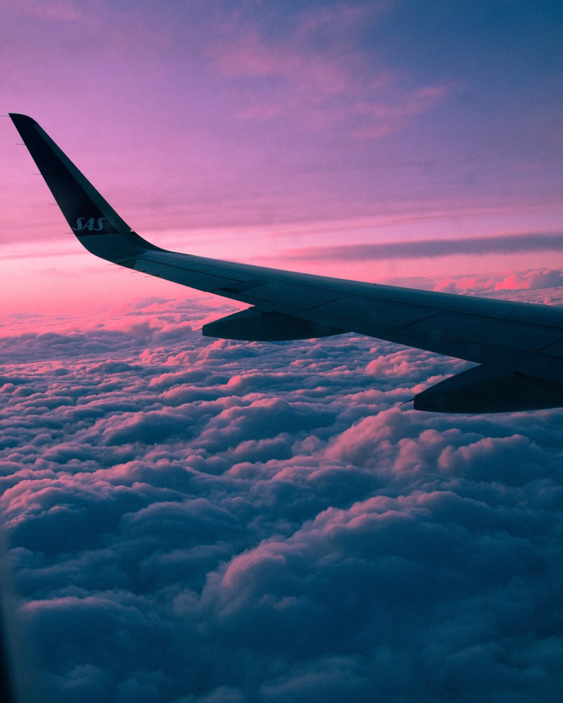 Airplane wing on the sky