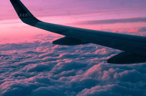 Airplane wing on the sky