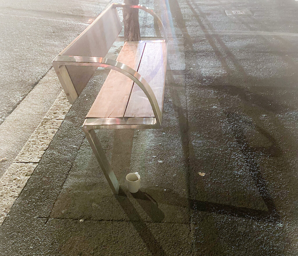 White mug under a bench