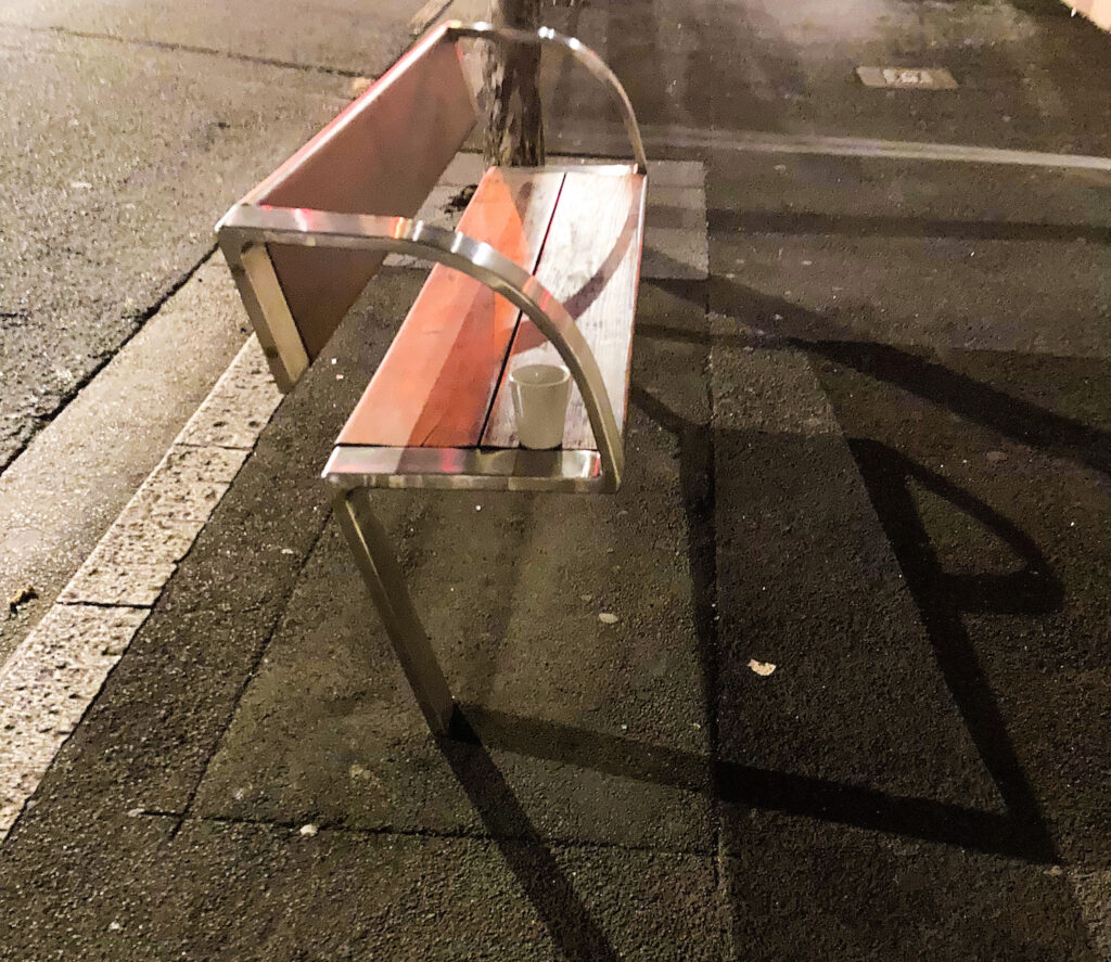 White mug on top of a bench