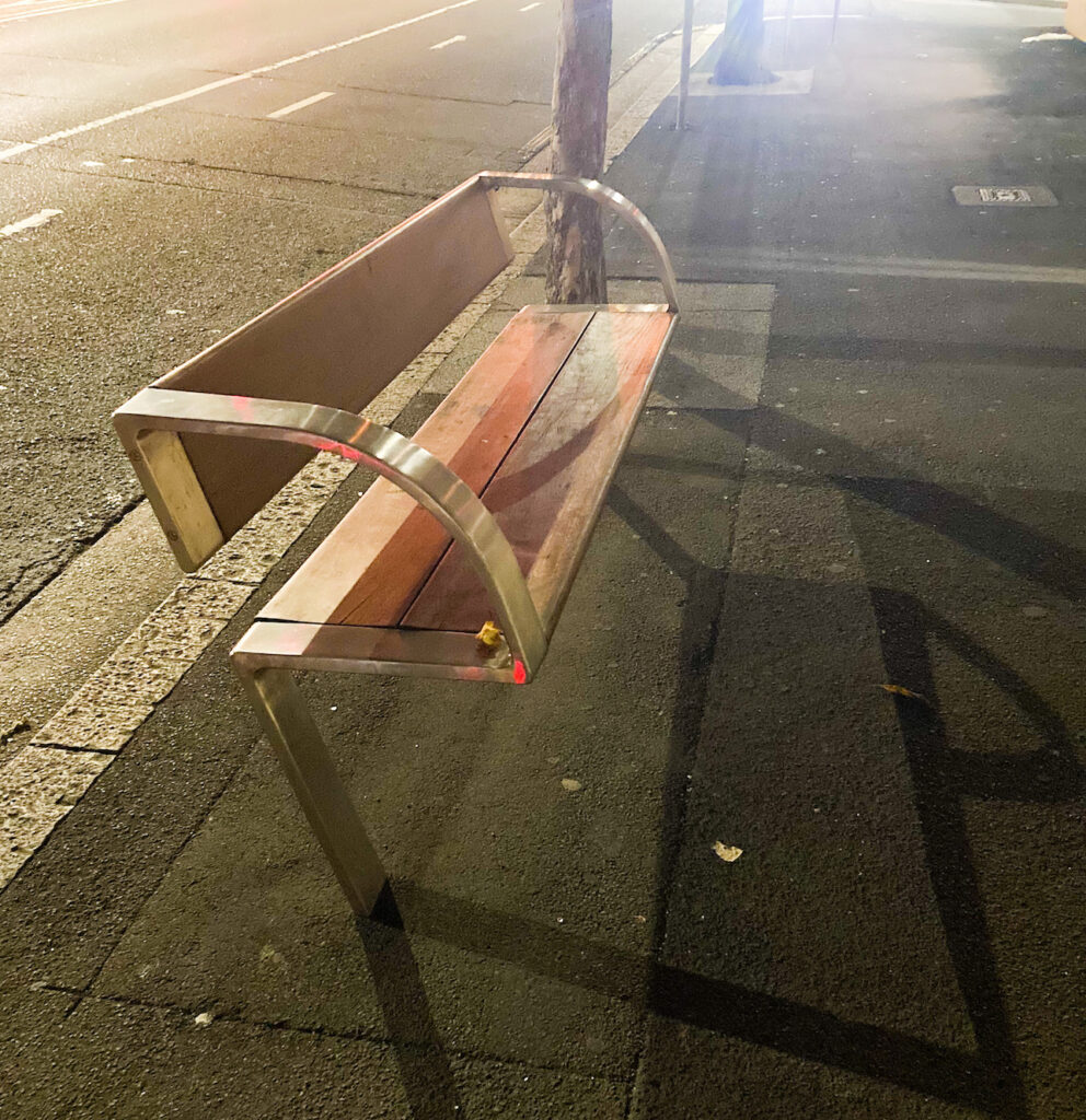 Core of an apple on a bench